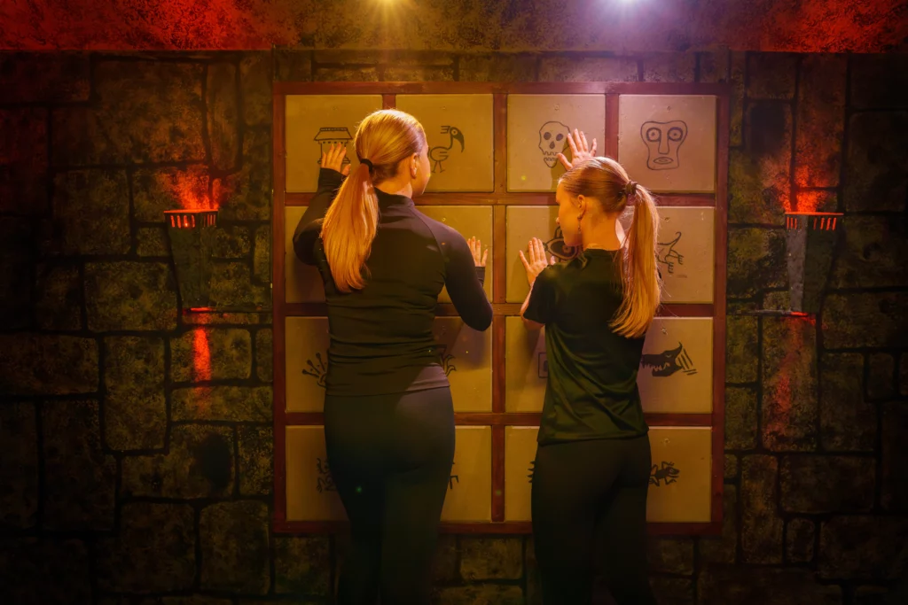 two people pressing symbols