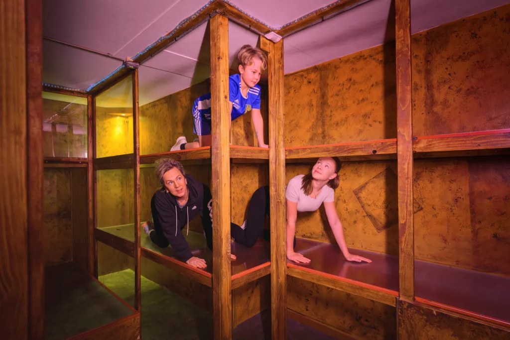 Group crawling on wood scaffolding