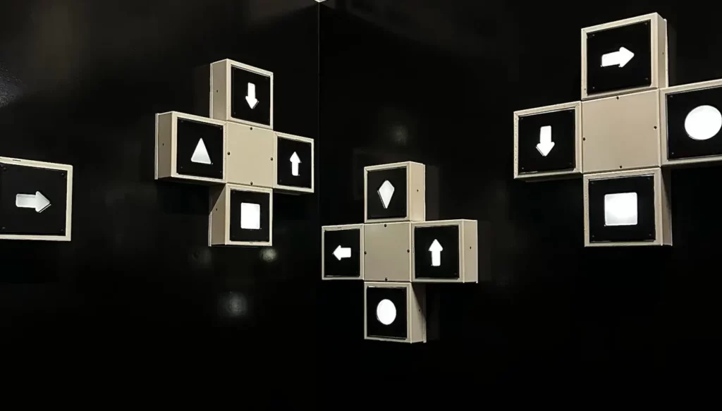 Black wall with white arrows