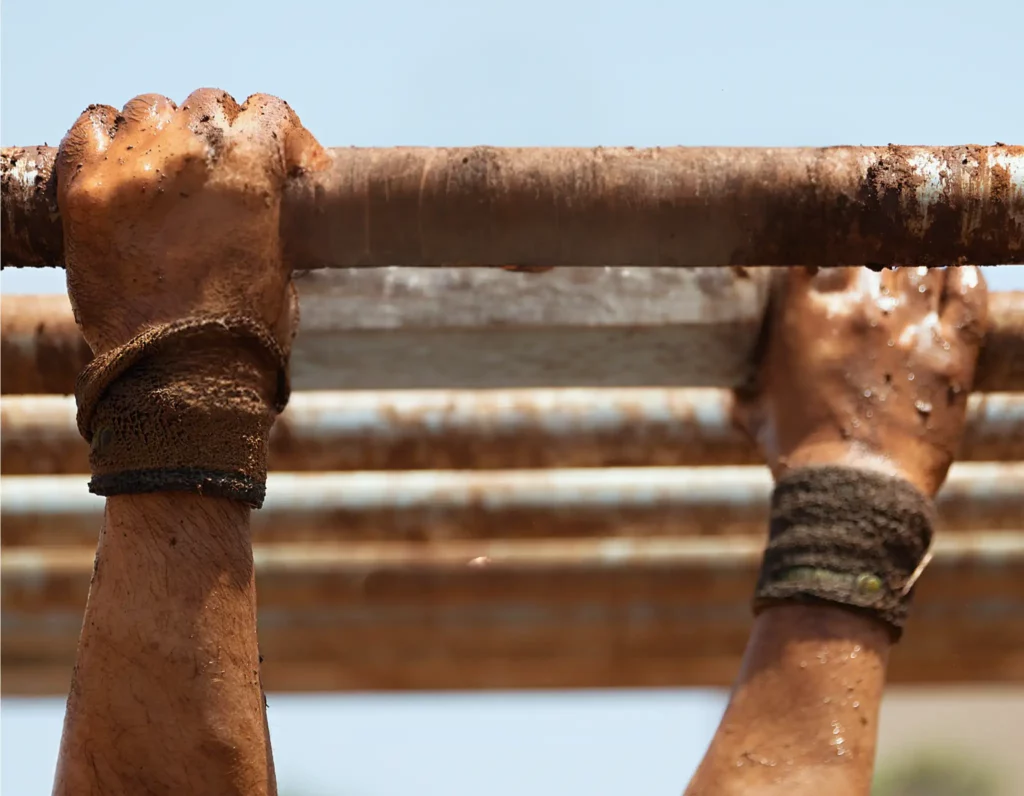 Muddy hands on monkey bars